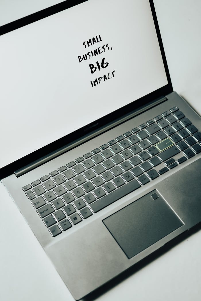 A laptop screen with the text Small Business, Big Impact, symbolizing modern entrepreneurship.